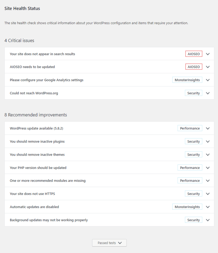 The Status page is divided into critical issues, recommended improvements, and passed tests.